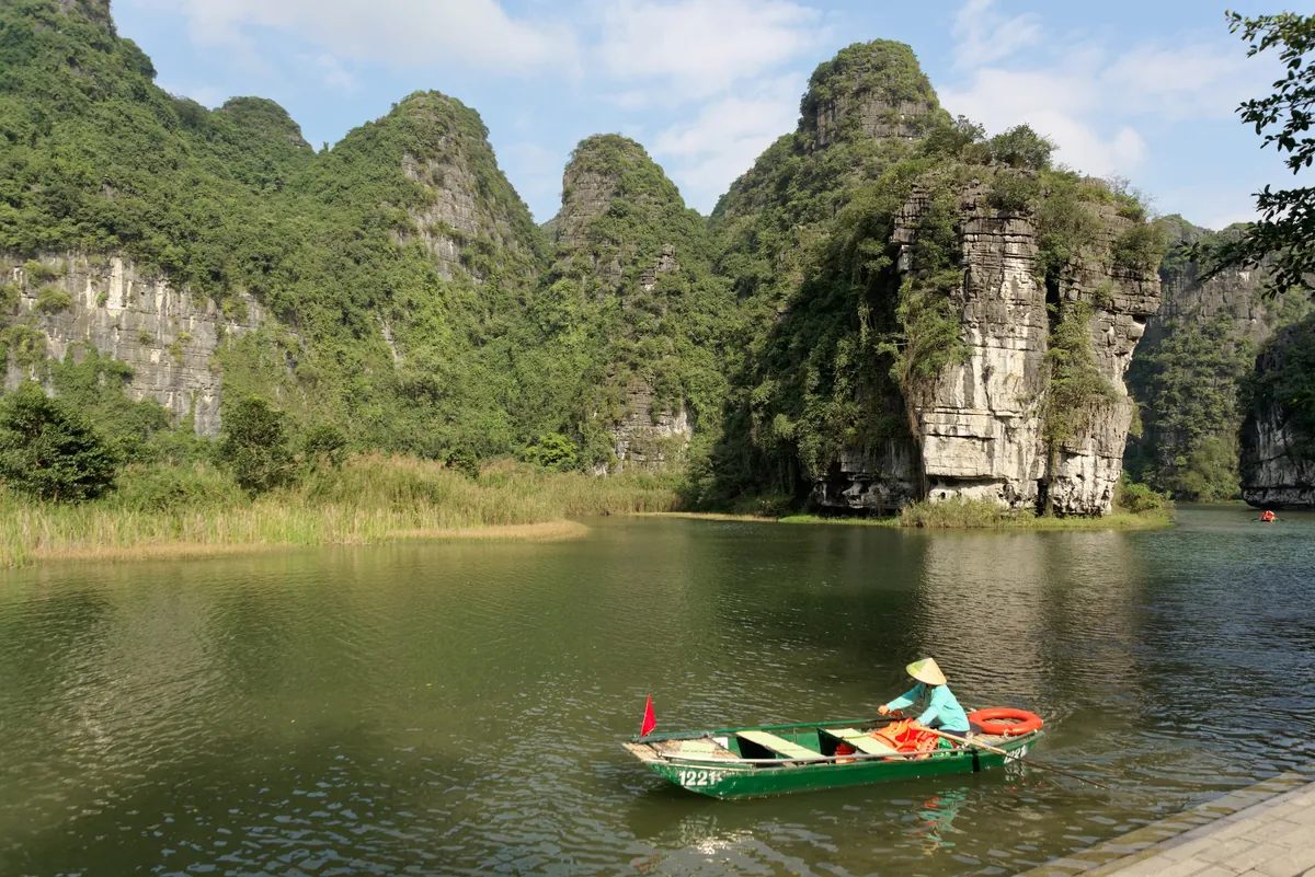 Rowed sampans on the river at Trang An, Ninh Binh