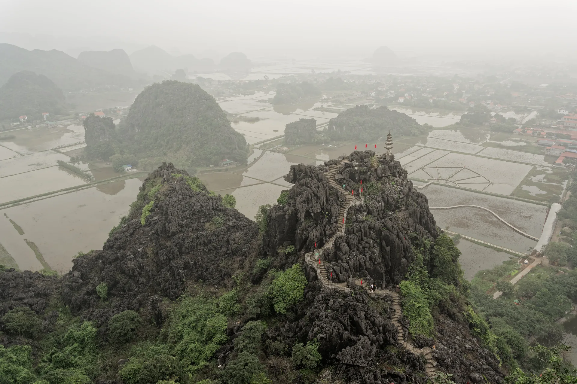 The view over Tam Coc's rice paddies and the Ngo Dong river from the Mua Cave dragon ridge, Ninh Binh